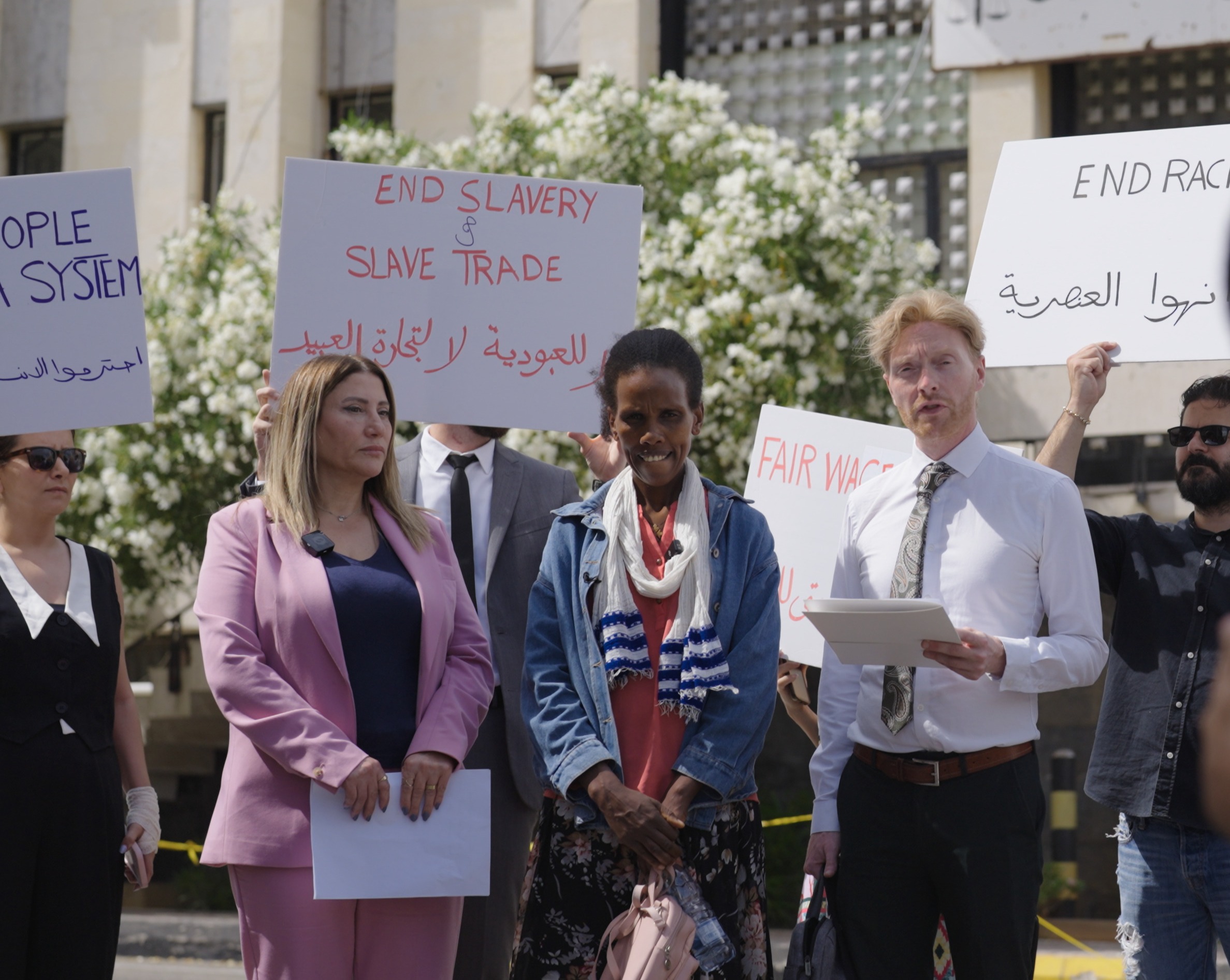 Ethiopian migrant worker Meseret Hailu with lawyers standing outside the court